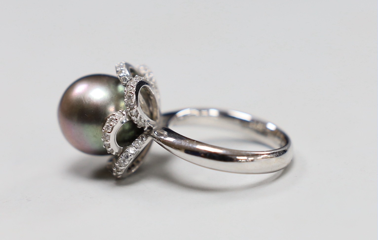 A modern Italian 750 white metal, cultured pearl and diamond chip set dress ring, with accompanying GCS report dated 10/11/2022, size M/N, gross weight 11.2 grams.